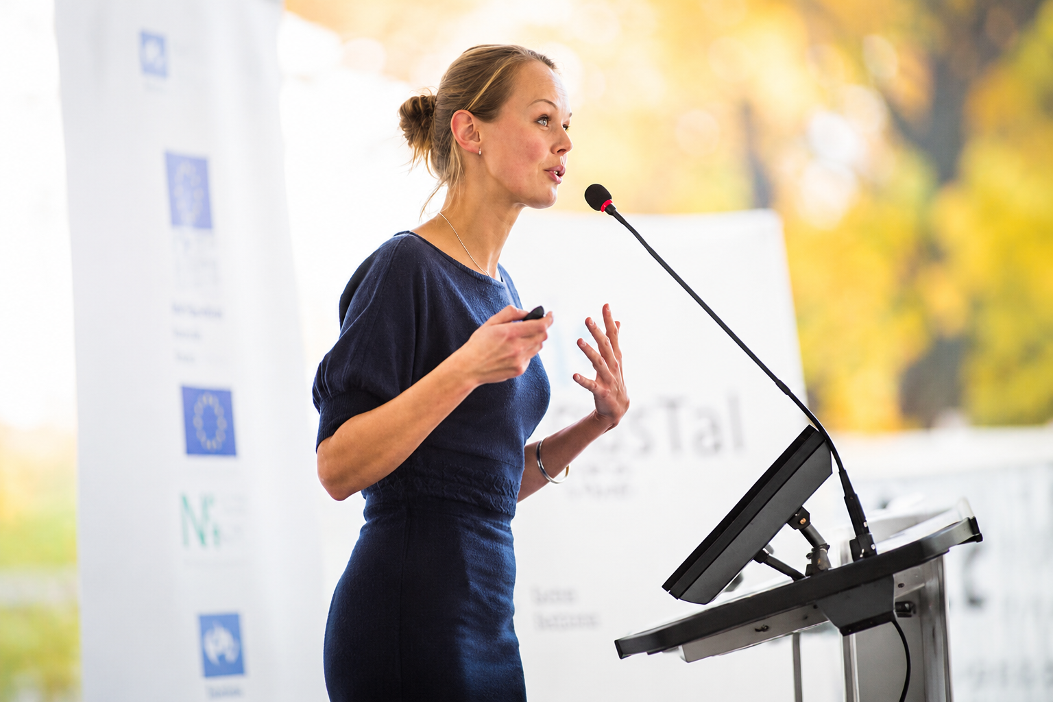 woman speaking into microphone