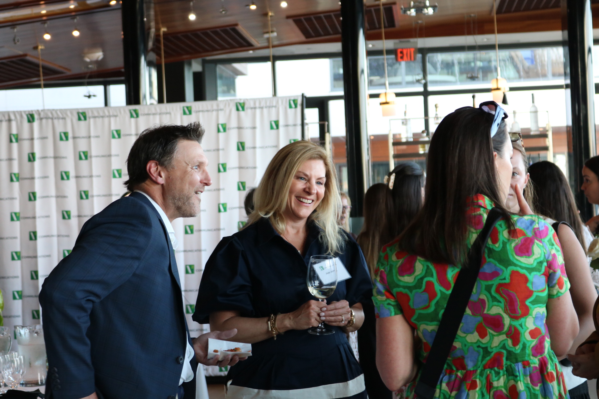 woman talking and laughing with others